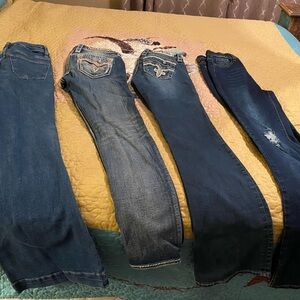 4 pairs of women’s size 26 jeans. From smoke and bug free home.